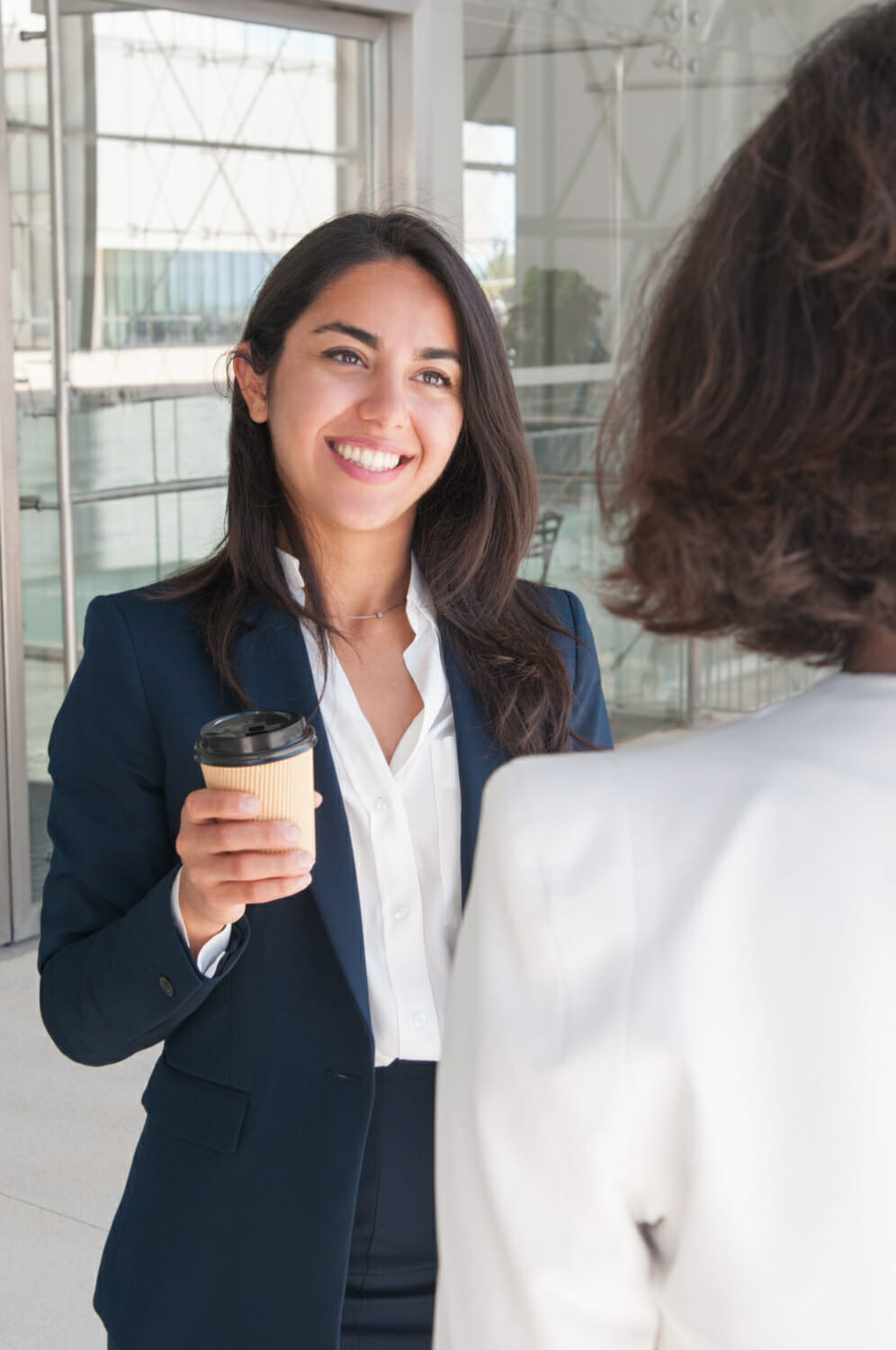 smiling-business-women-talking-drinking-coffee (3)